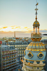 Wall Mural - Beautiful Parisian skyline with roofs and dramatic sunset