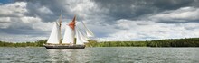 An Elegant Two-masted Gaff Schooner (tall Ship, Sailboat) Sailing In Mälaren Lake, Sweden. Travel, History, Transportation, Sailing, Sport, Cruise, Regatta, Nautical Vessel. Panoramic View