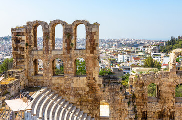Wall Mural - Ancient Greek ruins in Athens, Greece, Europe. Odeon of Herodes Atticus overlooking city