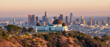 Los Angeles City Skyline And Griffith Observatory At Sunset