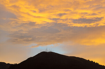 Wall Mural - Pichincha volcano at sunset with magic colors seen from Quito, Andes mountains, Ecuador.