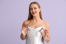 Attractive Woman With Nipple Clamps From Sex Shop On Color Background