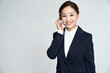 Young telemarketer business woman posing in studio shot
