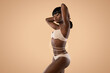 Sensual african american woman in lingerie posing on beige, collage