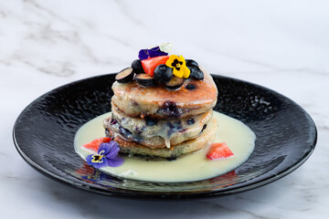 Sticker - stack of pancakes with condensed milk and fresh berries