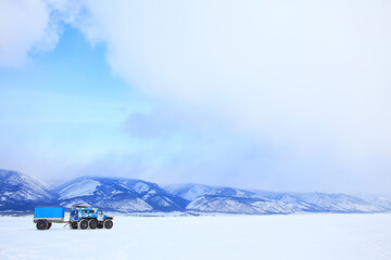 Wall Mural - off-road vehicle on the ice of lake baikal, olkhon travel extreme road auto in winter