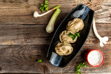 Wall Mural - Traditional manti food on plate, top view. The concept of oriental cuisine. Uzbek food manty dumplings. Uzbek food. banner, catering menu recipe place for text