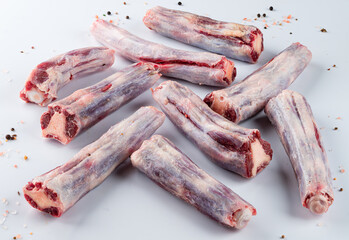 Wall Mural - raw beef tails on a light background close-up