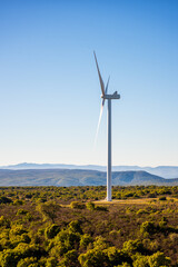 Wall Mural - wind turbines on a beautiful blue sky in a mountain wind farm in sardinia. renewable energy concept,
