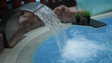 Poster - jets of water from the waterfalls in the pool. Water massage