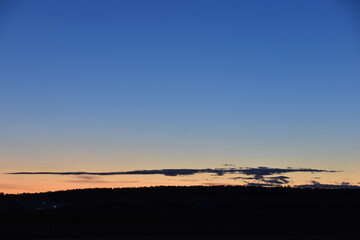 Wall Mural - Evening moonlit rural landscape with blue sky