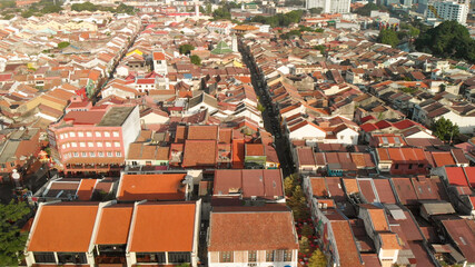 Canvas Print - Melaka, Malaysia. Aerial view of city homes and skyline from drone on a clear sunny day