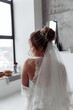 Beautiful hairstyle of the bride. Jewelry in the hair. The morning of the bride. Preparing for the ceremony.