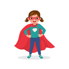 Sticker - Cute little girl plays wearing superhero costumes standing with hands on her hips pose