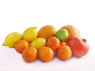 Wall Mural - colorful citrus fruits and pomegranate close up