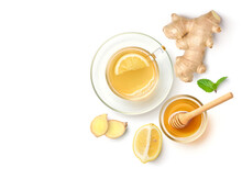 Flat lay of ginger tea with honey lemon isolated on white background.