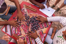 Peoples Hand On A Table Playing Domino In The Street Of Trinidad, Cuba