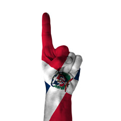 Hand pointing thumb up direction, dominican republic painted with flag as symbol of up direction, first and number one symbol - isolated on white background