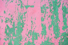 Rough, Old, Pink And Green Cement Wall With Many Scratches In The Caribbean.
