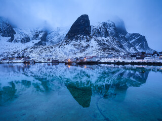 Wall Mural - view on the house in the lofoten islands, norway. landscape in winter time during blue hour. mountai