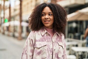 Poster - Young african american woman smiling confident standing at street