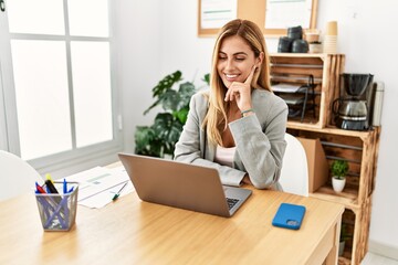 Sticker - Young caucasian businesswoman having video call using laptop at the office.