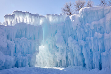 Wall Mural - Beautiful large icicles covered with snow on a bitter cold day in winter in northern Minnesota USA