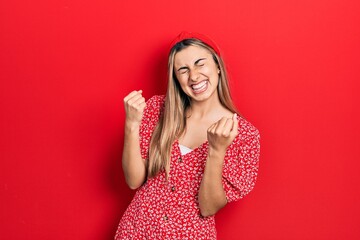 Sticker - Beautiful hispanic woman wearing summer dress excited for success with arms raised and eyes closed celebrating victory smiling. winner concept.