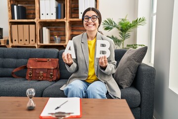 Poster - Young hispanic woman working at consultation office celebrating crazy and amazed for success with open eyes screaming excited.