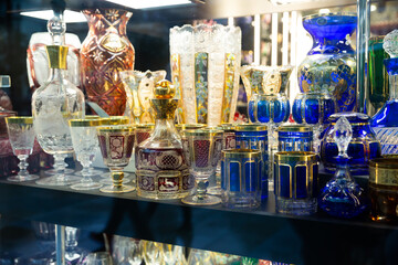 Wall Mural - Variety of glassware and souvenirs from famous Bohemian crystal on showcase of boutique..