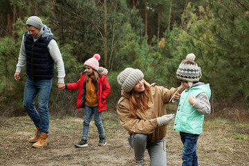 Wall Mural - Happy family spending time together in forest