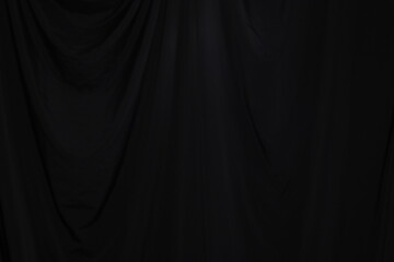 Black Curtain drape wave with studio lighting