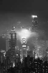 Wall Mural - Misty night view of Victoria harbor in Hong Kong city