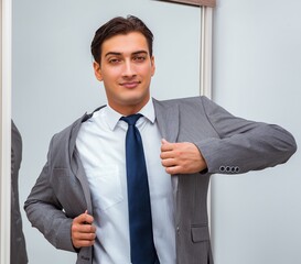 Wall Mural - Businessman dressing up for work