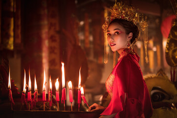 portrait of asian woman in traditional Chinese dress in Chinese shrine