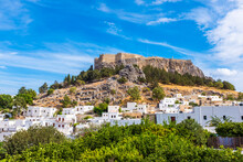 Hill With Acropolis Near Town Of Lindos On Sunny Day, Rhodes, Greece