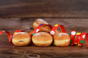 Wall Mural - 'Berliner Pfannkuchen', a traditional German donut like dessert filled with jam made from sweet yeast dough fried in fat. Traditional served during carnival.