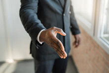 Hand Gesture Of Friendliness Of An African Man In A Suit 