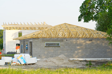 Wall Mural - The building structure of the house is made of concrete blocks. roof frame made of wooden beams. DIY private house construction.