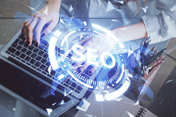 Aufkleber - Double exposure of woman hands working on computer and seo hologram drawing. internet search concept.