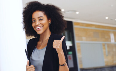 Poster - It's all systems go. Portrait of a confident young businesswoman showing a thumbs up gesture in a modern office.