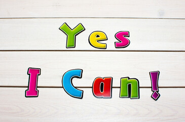 yes i can! positive affirmation, statement. bold neon letters on white washed wood table.