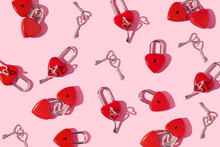 Valentines Day Creative Pattern With Heart Shaped Bright Red Padlocks And Keys On Pastel Pink Background. 80s Or 90s Retro Fashion Aesthetic Love Concept. Minimal Romantic Idea.