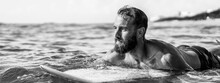 Horizontal Banner With Young Hipster Man Swimming On The Surfboard Into The Sea Water Waiting For A Big Wave - Guy Having Fun Doing Extreme Sport - Adventure And Freedom Concept Doing Water Sports