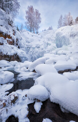 Fototapete - Photo of frozen waterfall on river Pescherka in winter. Siberia, Russia