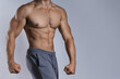 © blackday - Muscular male torso against gray background