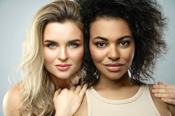 Wall Mural - portrait of caucasian and african american women in studio