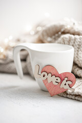 Wall Mural - Composition for Valentine's Day with a cup and a heart-shaped gingerbread.