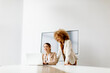 © BGStock72 - Young businesswomen discussing and using laptop in the modern office