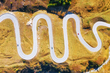Wall Mural - a road with turns through a mountain pass. aerial landscape. an aerial summer landscape in the dolom